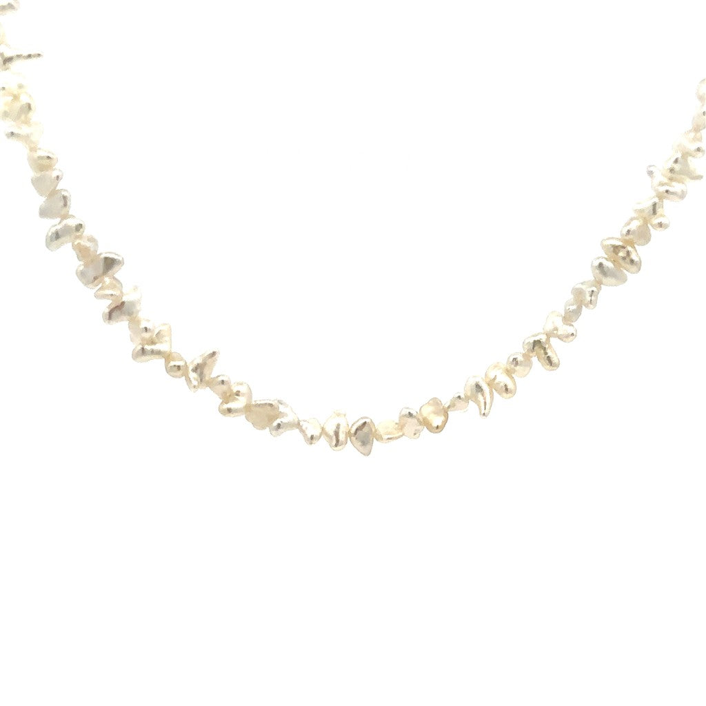 Single Strand Pearl Strand Necklace Strung on 14 Karat Gold 18" Long with Cream Cultured Keshi Fresh Water Pearl
