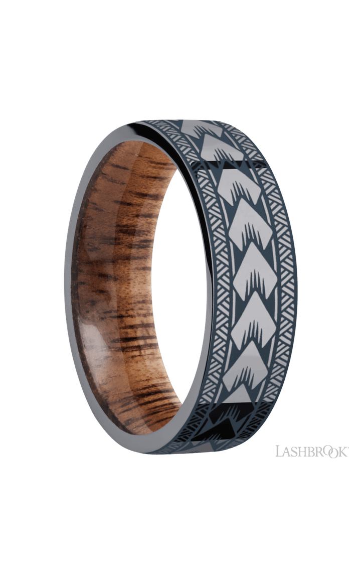 7 mm wide/Flat/Tantalum band with a laser carved Maori pattern also featuring a Koa sleeve.