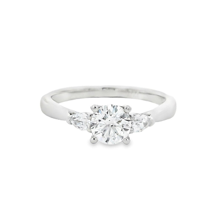 Three Stone Diamond Engagement Ring White Platinum With A 0.57 Carat Round Shape Diamond Center & Pear Shape Diamonds Side Stones