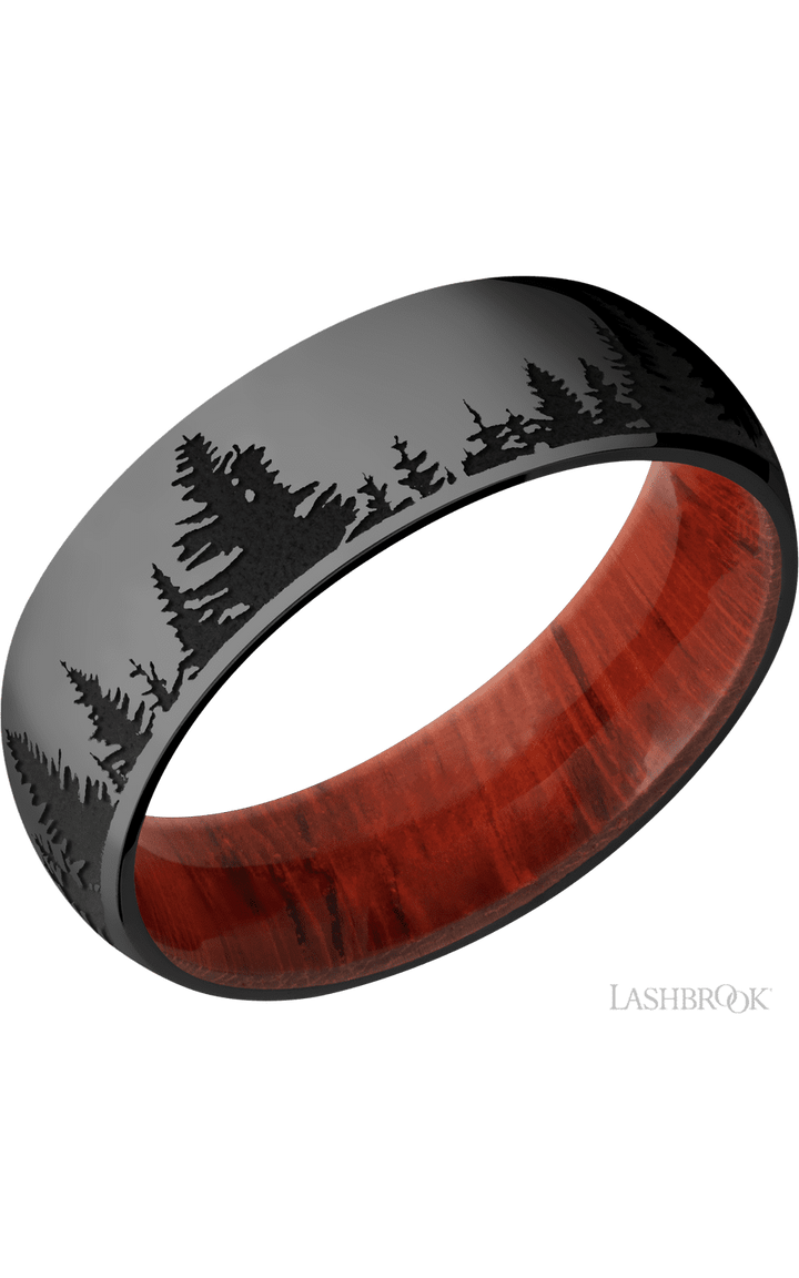 7 mm wide/Domed/Zirconium band with a laser carved Trees pattern also featuring a Padauk sleeve.