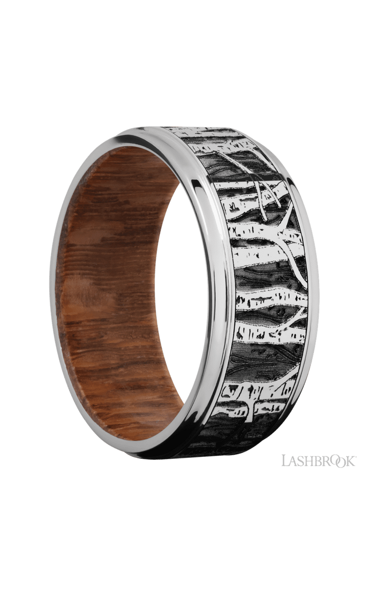 9 mm wide/Flat Grooved Edges/Cobalt Chrome band with a laser carved Aspen pattern also featuring a Leopard Wood sleeve.