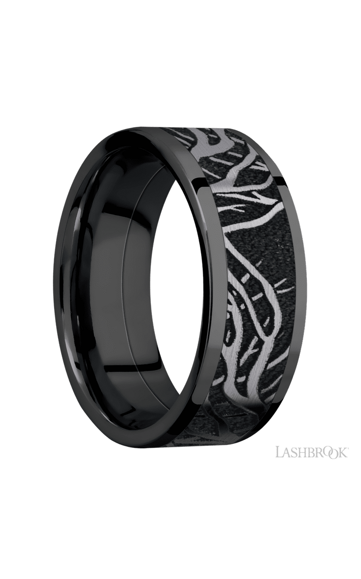 8 mm wide/Flat/Zirconium band with one 6 mm Centered inlay of Tantalum with a laser carved Branches pattern.