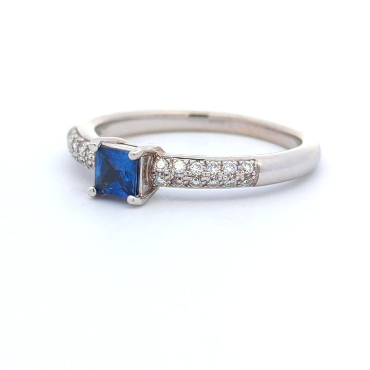 1/3 Carat Solitare Accent Style Engagement Ring White 14 Karat Gold With A Sapphire Center Stone And Diamonds Accent Stones
