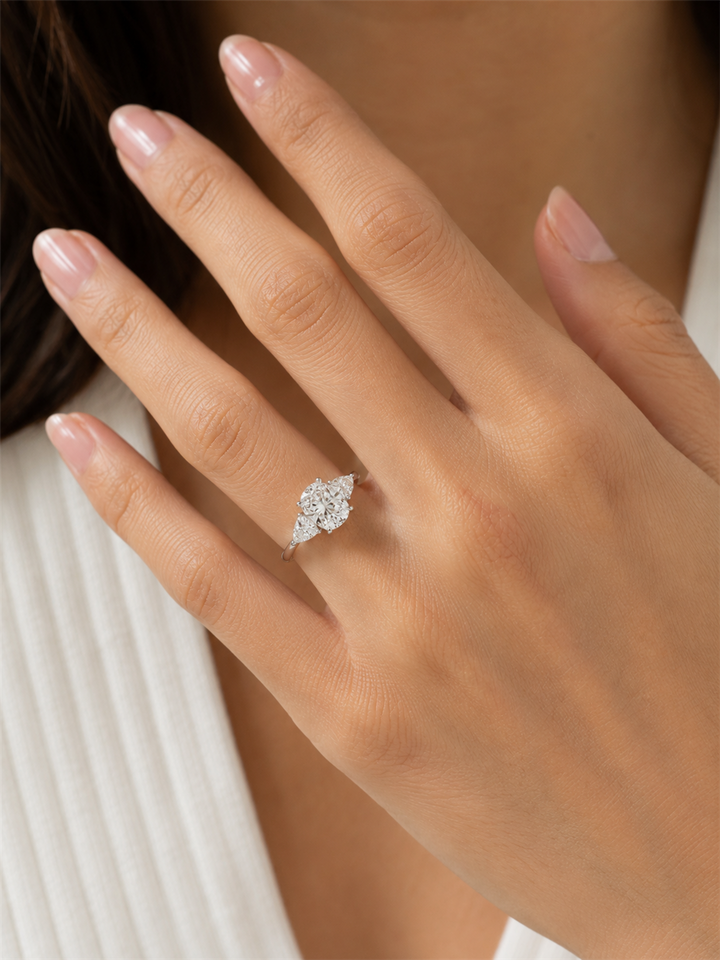Three Stone Lab Diamond Engagement Ring White 10 Karat Gold With A 1.01 Carat Oval Shape Lab Diamond Center & Trillian Shape Lab Diamonds Side Stones