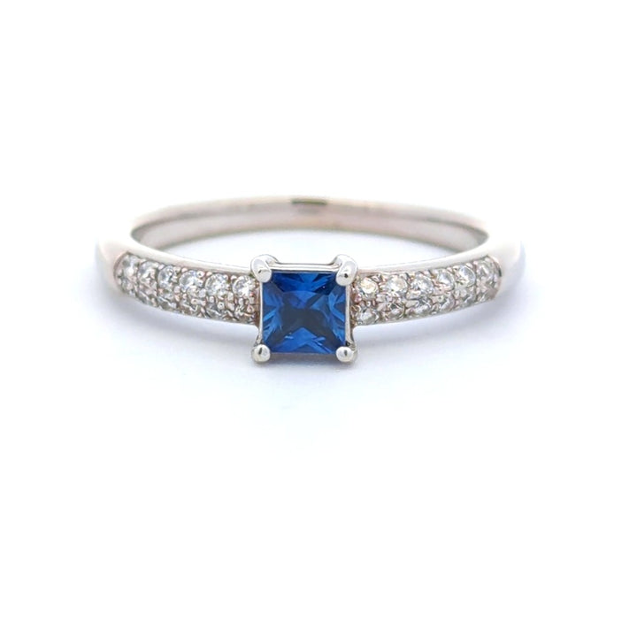 1/3 Carat Solitare Accent Style Engagement Ring White 14 Karat Gold With A Sapphire Center Stone And Diamonds Accent Stones