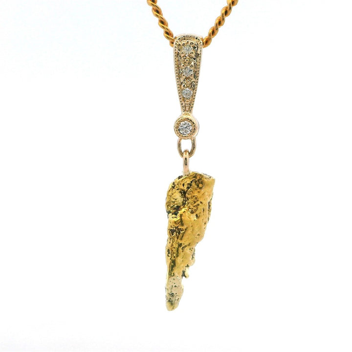 Alaskan Gold Nugget Necklace Indian Drop 1.09 " long On a Base Metal Yellow Display Chain With G/H Diamonds